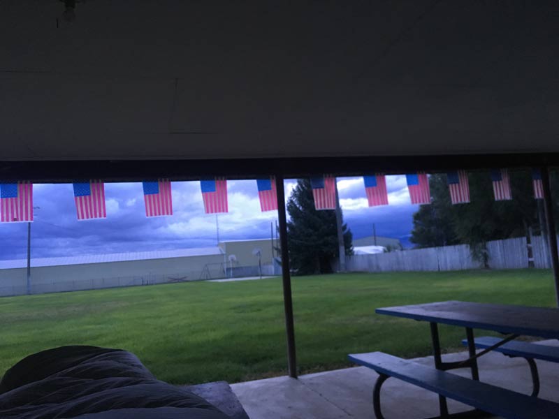 Mini American flags hanging from picnic shelter