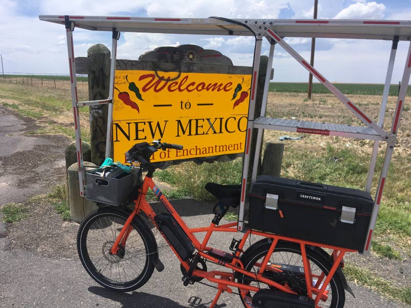 Sunride in front of the New Mexico welcome sign