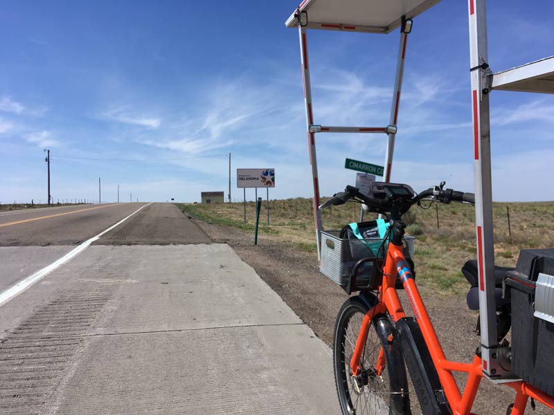 Sunride in front of the Oklahoma welcome sign