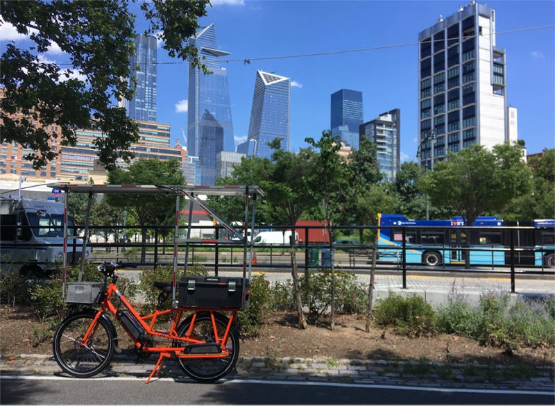 Sunride pauses on the bike trail to take in some of the new buildings in Mid-town Manhattan