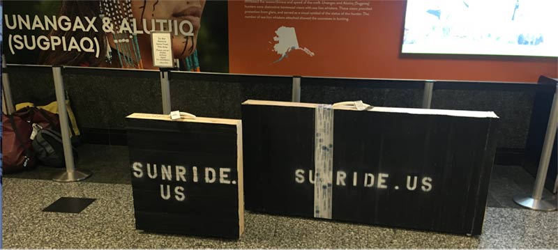 Two crates holding Sunride in baggage claim