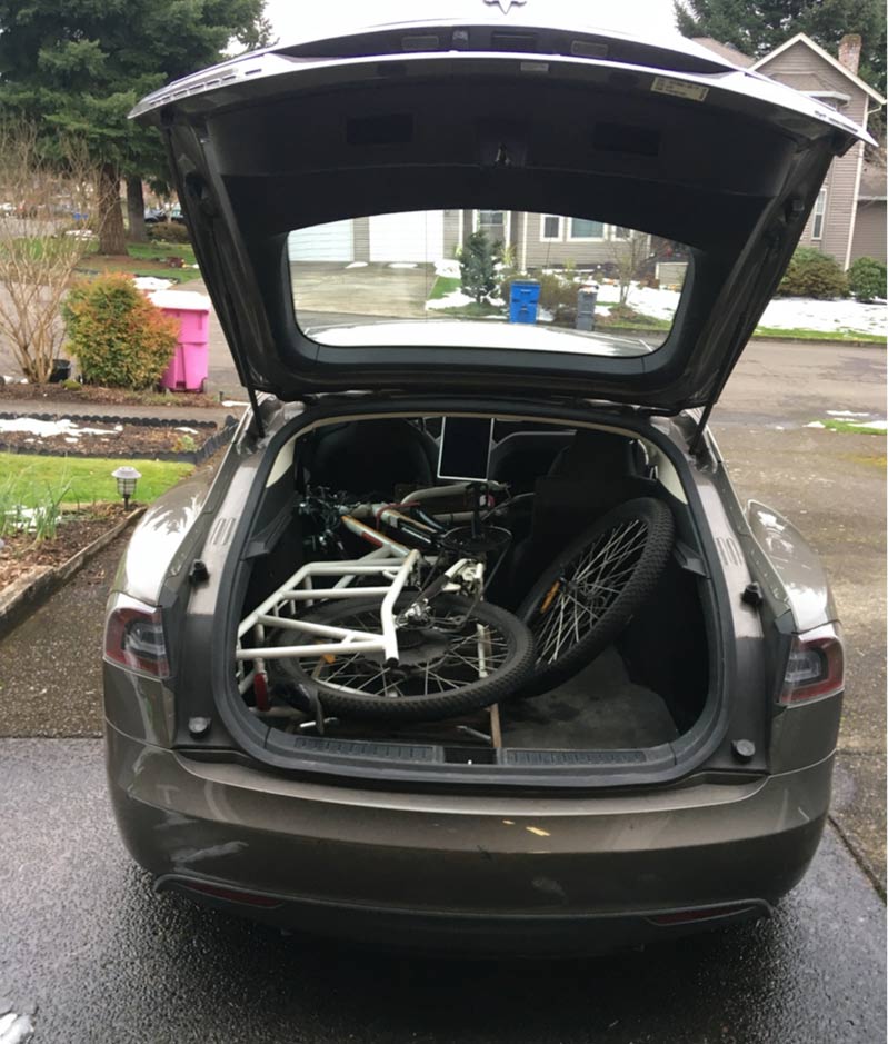 Open trunk of my Tesla with my electric bike, Sunride, which fit inside once I took the front wheel off.